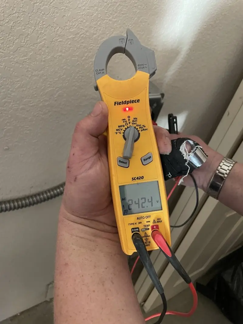 Voltage testing with clamp meter during Whole House Surge Protector in Hazlet